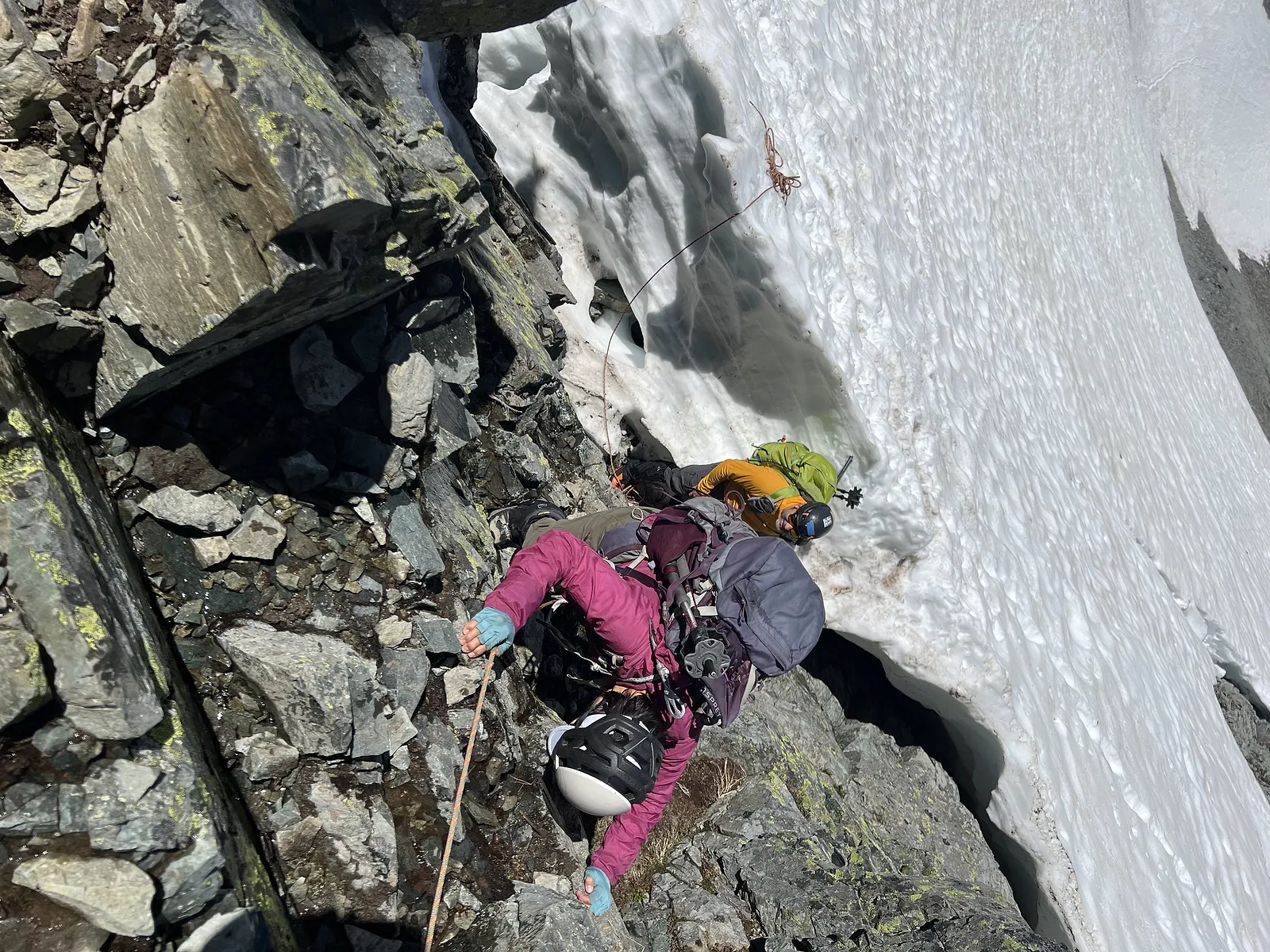 Downclimbing the rock near the moat